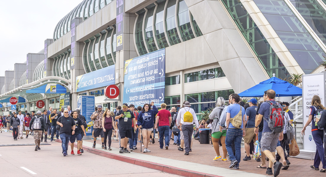 Pedestrians and Comic-Con fans in front of the San Diego Convention Center